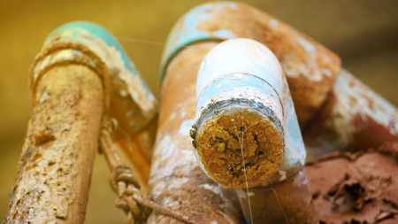 Surface water pipes and old water tanksの写真素材