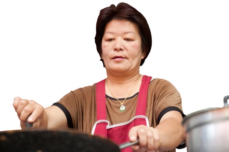 Thai woman is cooking the foodの写真素材
