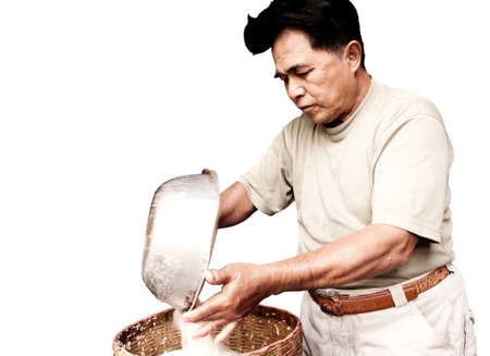 A man is cooking a foodの写真素材