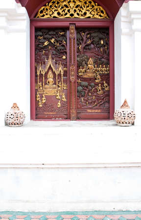 Thai art wooden window on an old wallの写真素材