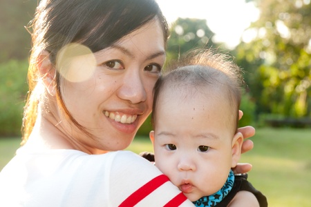 Portrait of mother and babies on locationの写真素材