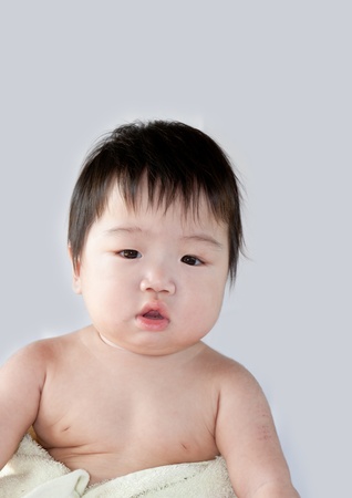 Baby boy posing for his first portraitの写真素材