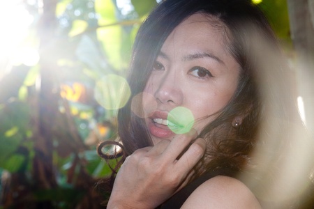 Young woman outdoors portrait. Soft sunny colors.の写真素材