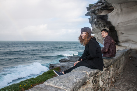 the couple walk pass the wallの写真素材