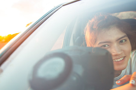 The girl in the carの写真素材