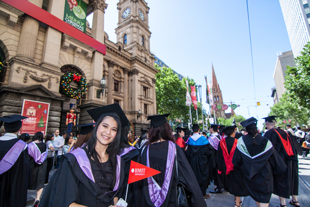 Melbourne, Australia - December 17, 2014 - RMIT university graduation day - the students walk along the Swanton St in Melbourne city for celebration day in graduation dayのeditorial素材