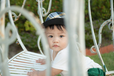 Thai boy with the hat in the park