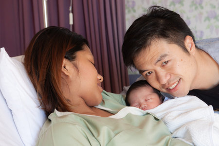 Mother and kid in the holding within the hospital