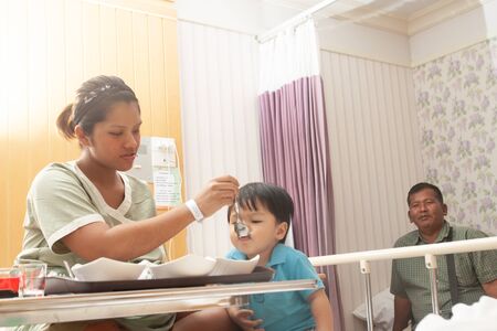 The family with newborn baby and smiley faceの写真素材