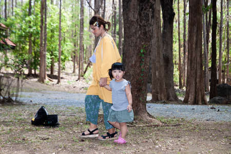 Mother and girl in the forest, Thailandの写真素材