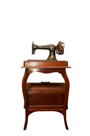 Old sewing machine in white backgroundの写真素材