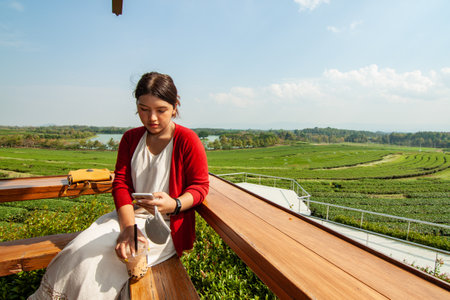 Thai girl sitting on the benchの写真素材
