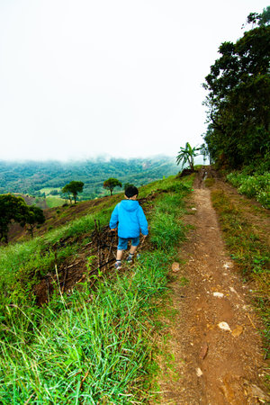 Thai boy in the feild. Chiang Rui, Thailandの写真素材