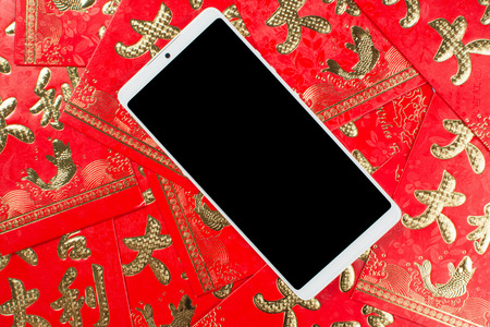 festive red envelope and mobile phoneの写真素材