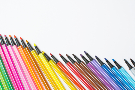 Colored brush pens at white backgroundの写真素材