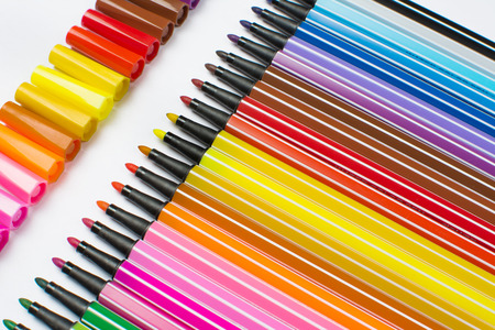 Colored brush pens at white backgroundの写真素材