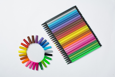 Colored brush pens at white backgroundの写真素材