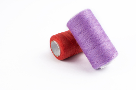 Colorful sewing threads on white backgroundの写真素材
