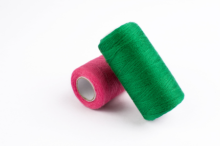 Colorful sewing threads on white backgroundの写真素材