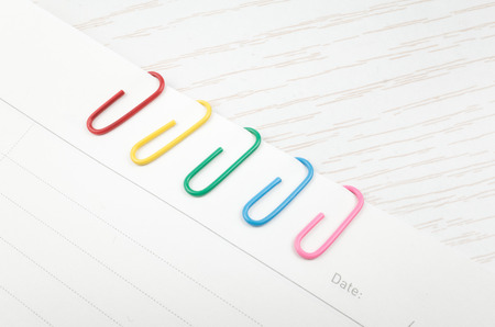 Colorful paper clips on white backgroundの写真素材