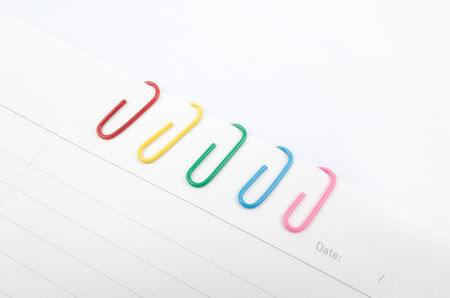 Colorful paper clips on white backgroundの写真素材
