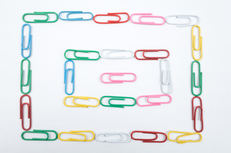 Colorful paper clips on white backgroundの写真素材