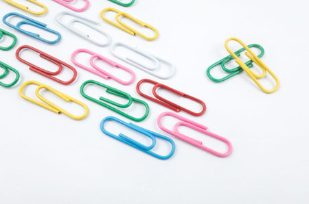 Colorful paper clips on white backgroundの写真素材