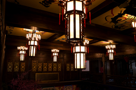 The roof of a traditional Chinese architectural interior is covered with lamps representing traditional Chinese culture.のeditorial素材