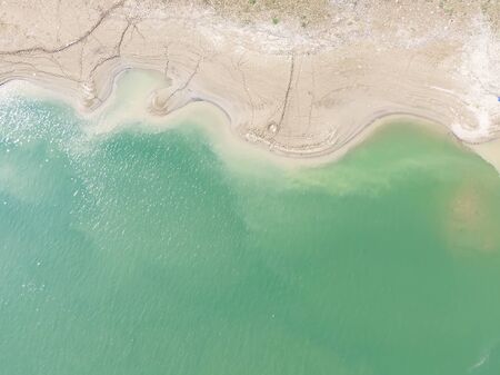 waterfront aerial picture, green river and  footprints of the river beachの写真素材