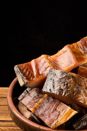 A bowl of salted fish on wooden tableの写真素材