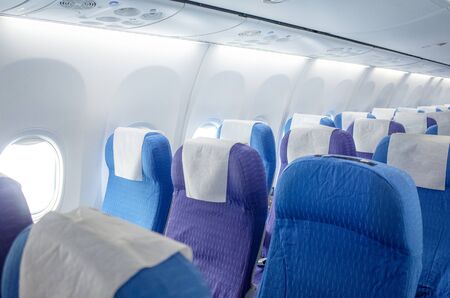 Bright civil airliner with empty seatsの写真素材