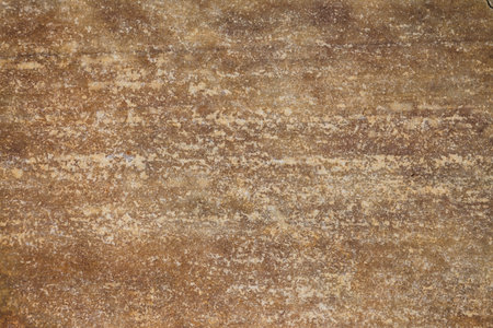A grungy stone texture on an old stained stone block.