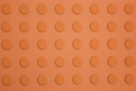 An orange non-slip surface viewed from directly above.