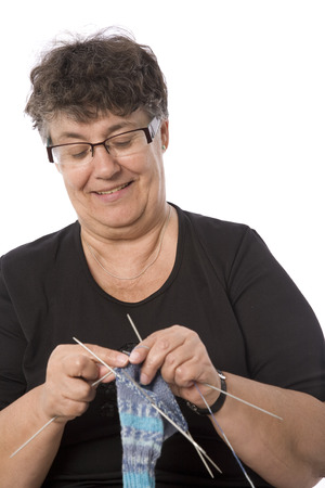 An elderly woman knitting.の写真素材