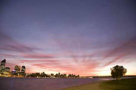 An early morning shot of Perth city with a stunning purple sunrise over Swan River.の写真素材