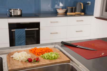 Vegetables cut and ready for a home recipe in a modern kitchen.
