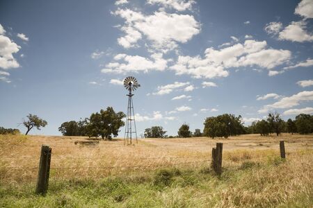 A rural scene with an Australian windmill.の写真素材