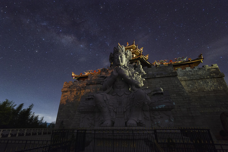 Milky Way above Guan Yin statue at 500 Lohan Temple, Bintan Island, Indonesiaの写真素材