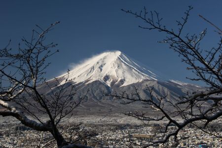 Mount Fuji on close-up with a town below, Japanの写真素材