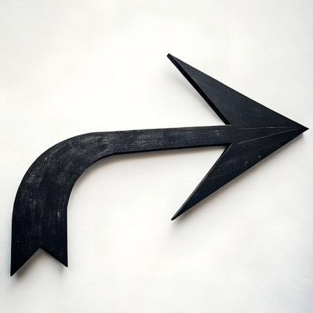 Black arrow sign on white wall background. Copy space for text.の素材