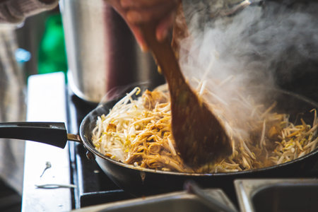 Pad Thai is Thai food Noodle and tofu mixed with tamarind sauce and bean sprouts and spring onion in...