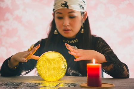 A picture of a woman holding a candle to perform magic rituals and mysteries about superstition in...