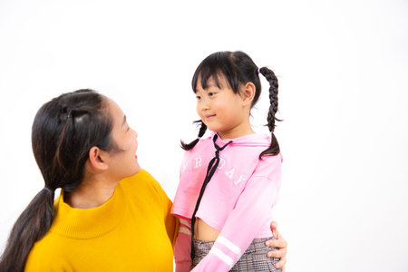 Happy asian family woman with little child smiling and fun and  in love for family in the white background.の写真素材