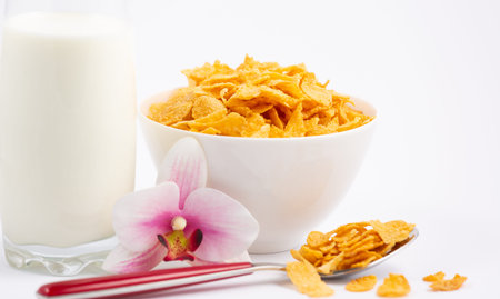 Corn cereal breakfast flake in children cups and milk is a healthy breakfast that is good for your...