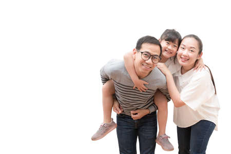 Happy family woman and a man with little child smiling and fun isolated over white backgroundの写真素材