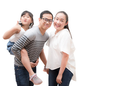 Happy family woman and a man with little child smiling and fun isolated over white backgroundの写真素材