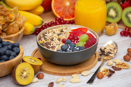Group Fruits Breakfast mixed vegetables with salad bowl, nuts bowl, strawberry, banana, and...