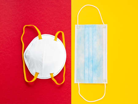 Doctor Mask ,cloth mask and N95 for wearing germ protection Coronavirus or covid 19 and gel alcohol or hand sanitizer bottle for washing hand, fever monitor for doctor hospitals on yellow background.の写真素材