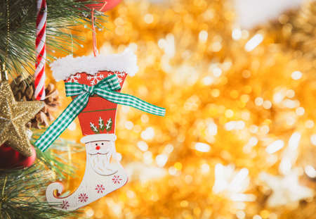 Merry Christmas holiday with star and red hearts , toy socks, Merry Christmas and happy New Year and Family happiness festival on red bokeh background Beautiful decorationsの写真素材