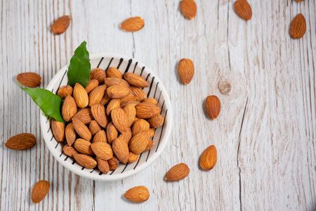 Peanuts Nut mixed salt in a wooden plate is Protein food and healthy food for diet food on a black...